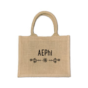 Show off your Alpha Epsilon Phi pride with this stylish floral burlap tote, the perfect accessory for sorority life and Greek events.