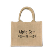 Carry your Alpha Gamma Delta spirit with this eco-friendly floral burlap tote, perfect for everyday sorority life and celebrations.