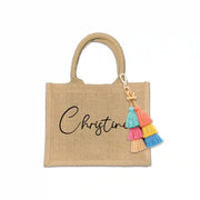 Whether it's for a bachelorette party, bridal bash, birthday, or any other celebration, this premium jute tote is durable, eco-friendly, and stylish. Personalized with a person's first name and your choice of font style and ink color.