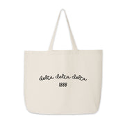 Delta Delta Delta Tote Bag – A spacious sorority bag featuring "Delta Delta Delta" and 1888, designed for carrying books, gifts, and more.