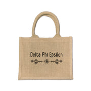 A chic floral burlap tote designed for Delta Phi Epsilon sisters, perfect for carrying your essentials with pride.