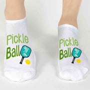 These cute and trendy pickleball gift socks are perfect for the entire family or team! A long lasting design is printed on both socks on a high quality and cushioned no show footie sock.