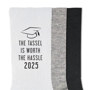 Custom graduation socks featuring the phrase 'The Tassel is Worth the Hassle' for 2025 graduates.