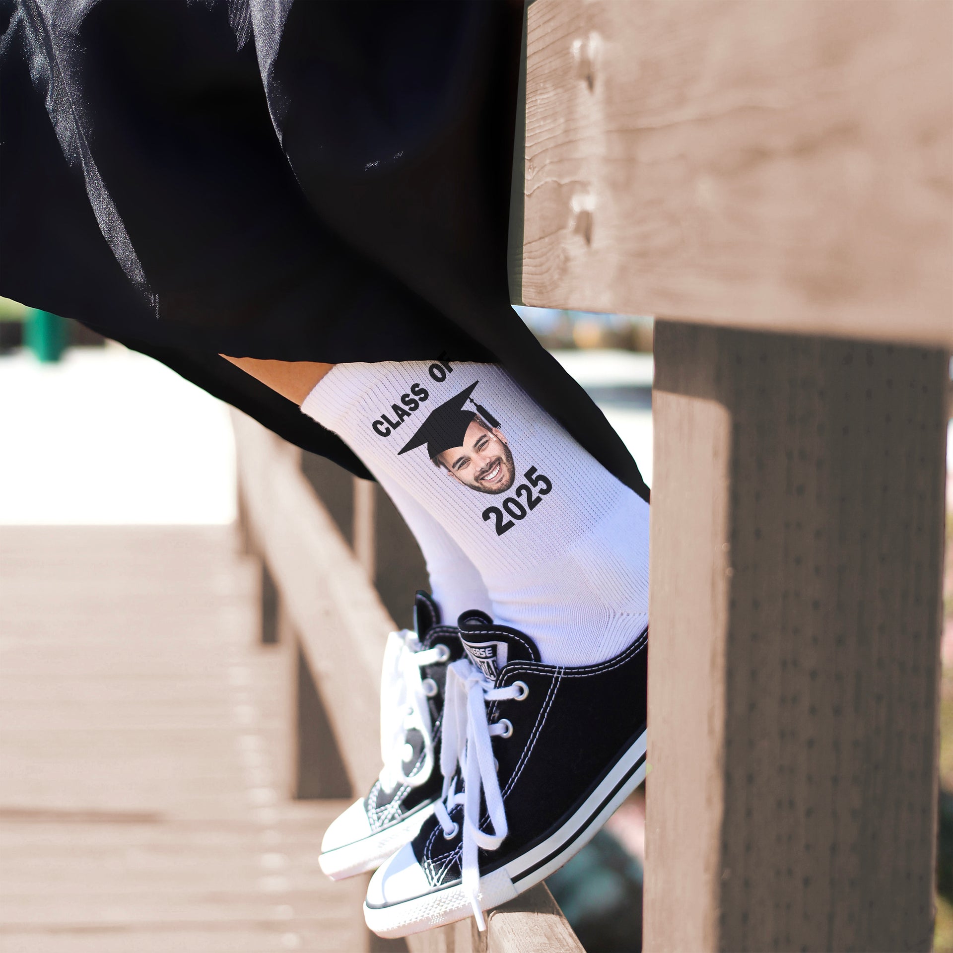 Personalized 2025 graduation socks with a photo of the grad in cap and gown—perfect for commemorating their achievement.