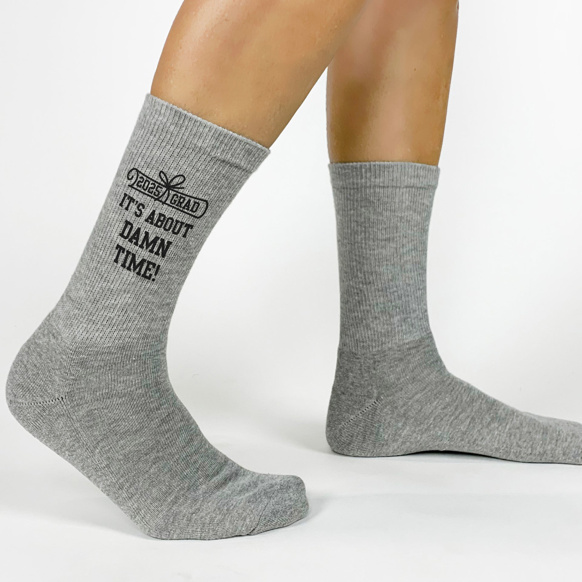 Unique graduation socks with 'It's About Damn Time' message for the Class of 2025.