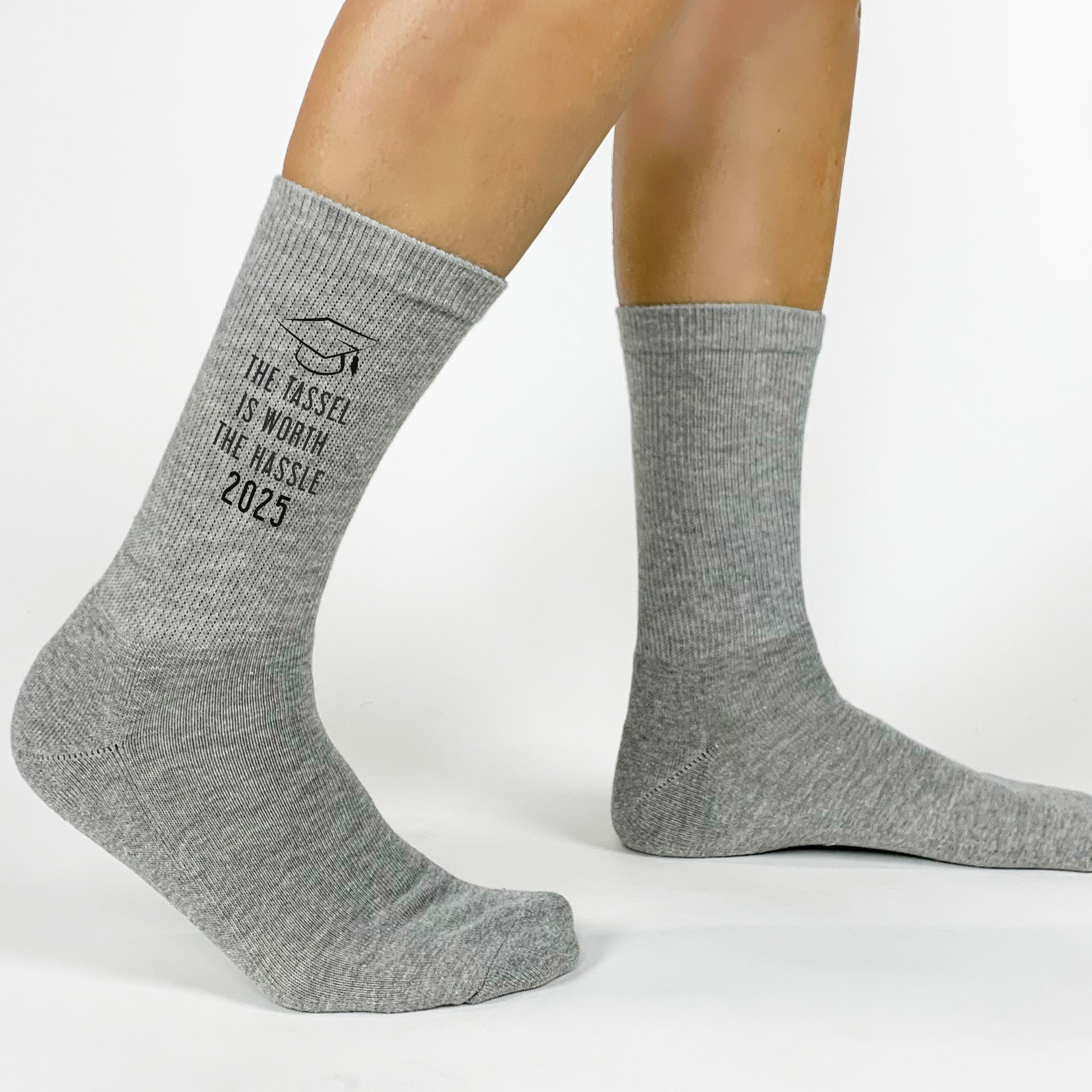 Commemorate graduation with 'The Tassel is Worth the Hassle' socks—perfect for 2025 seniors.