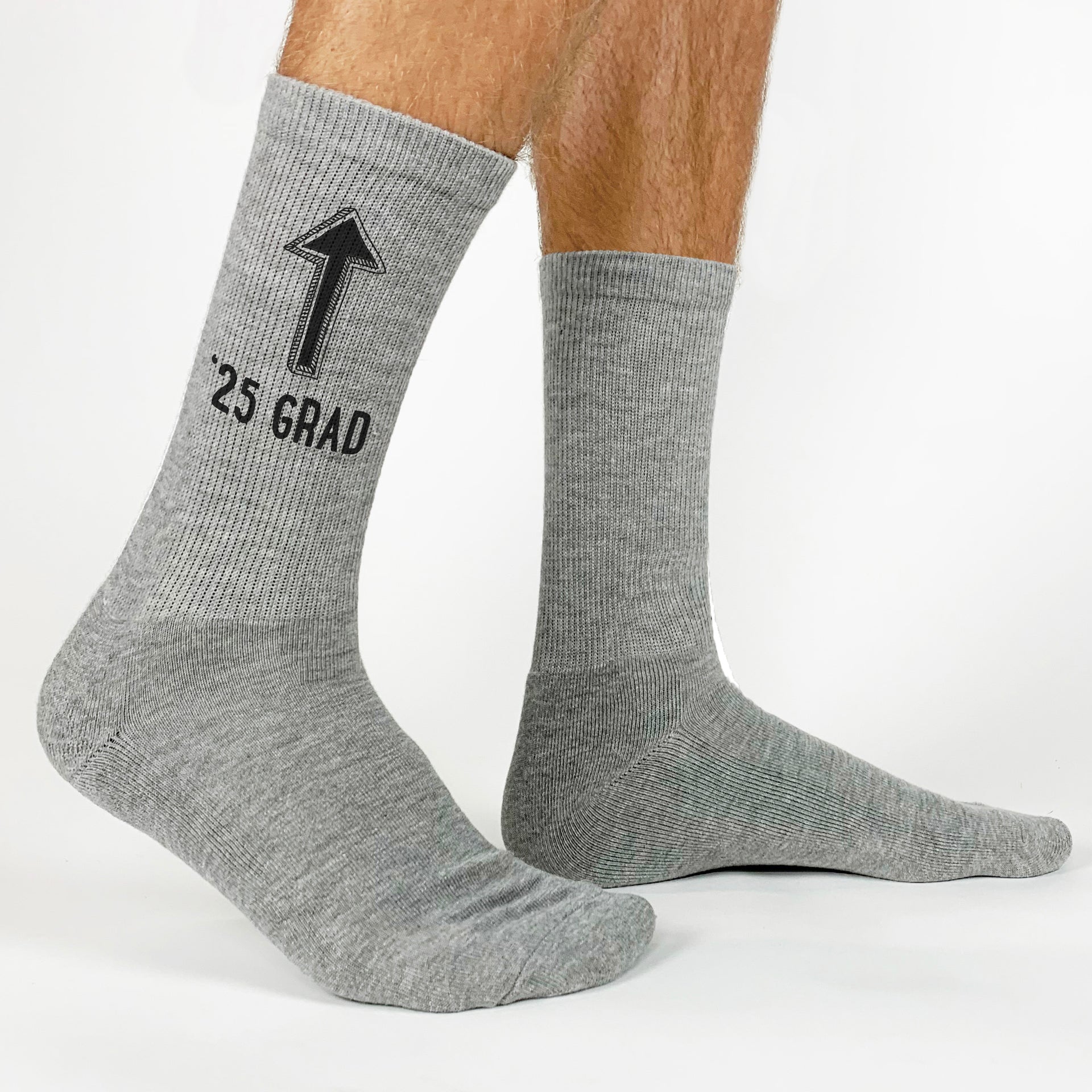 Custom-made socks for 2025 grads with an arrow pointing up—ideal for graduation celebrations.