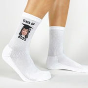 Celebrate the Class of 2025 with custom socks showcasing a photo of the graduate in their cap and gown.