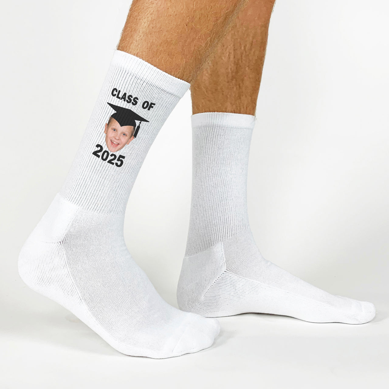 Personalized 2025 graduation socks with a photo of the graduate in cap and gown for a unique gift.