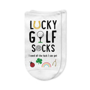 A pair of white no-show golf socks with the phrase "Lucky Golf Socks" printed on top, featuring a golf ball rolling toward the hole with a four-leaf clover flag. A fun and stylish gift for golfers who believe in a little luck on the course.