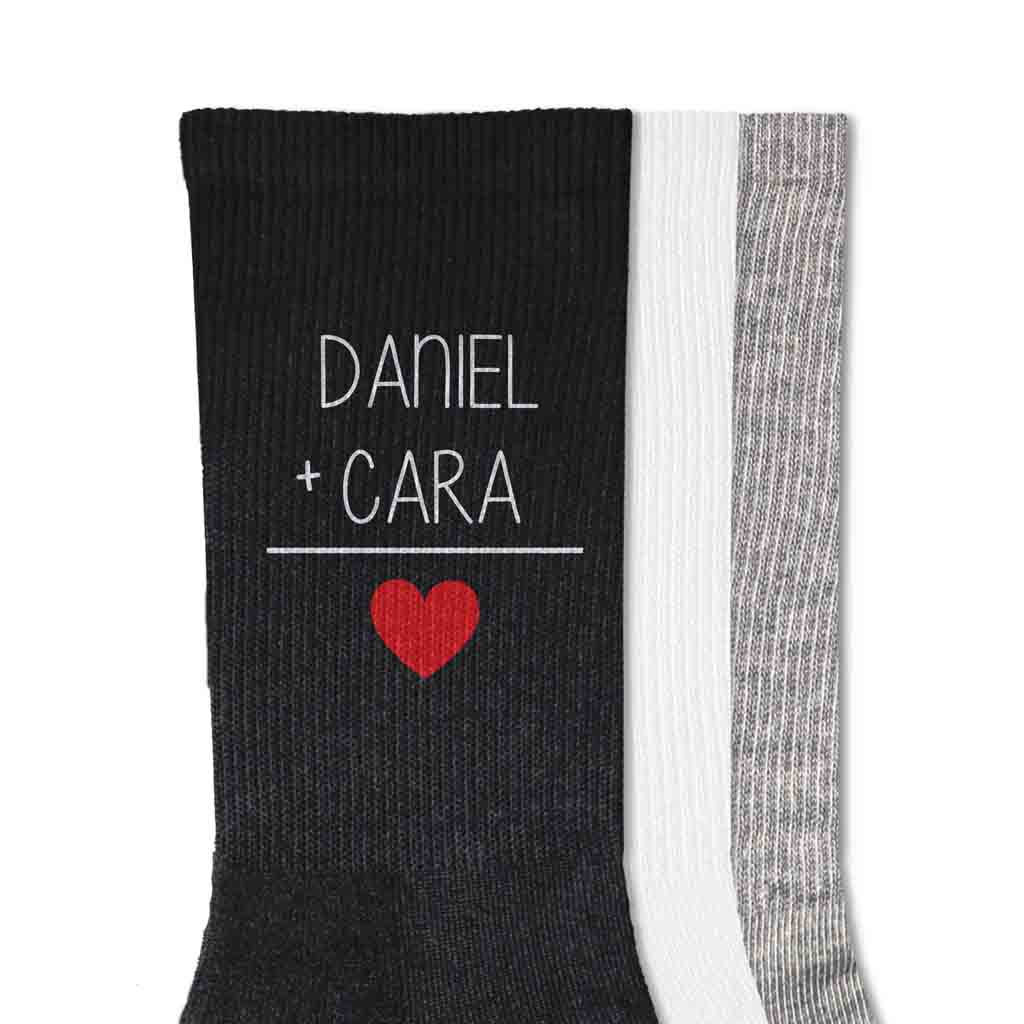 Socks for Valentines Day with a couples names with red heart