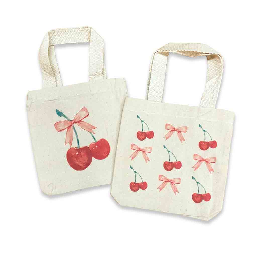 Two-pack mini canvas totes with cherry and coquette bow patterns