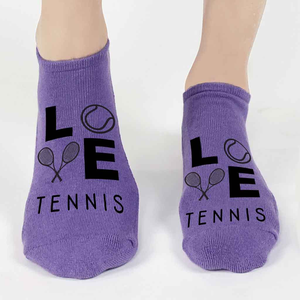 Our purple socks, 1 of the 3 pairs included, are printed with black ink and a simple LOVE Tennis text on the top of the foot of these tennis footie no show socks. 