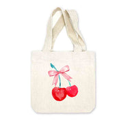 Gift-ready canvas totes with red cherry and pink bow designs