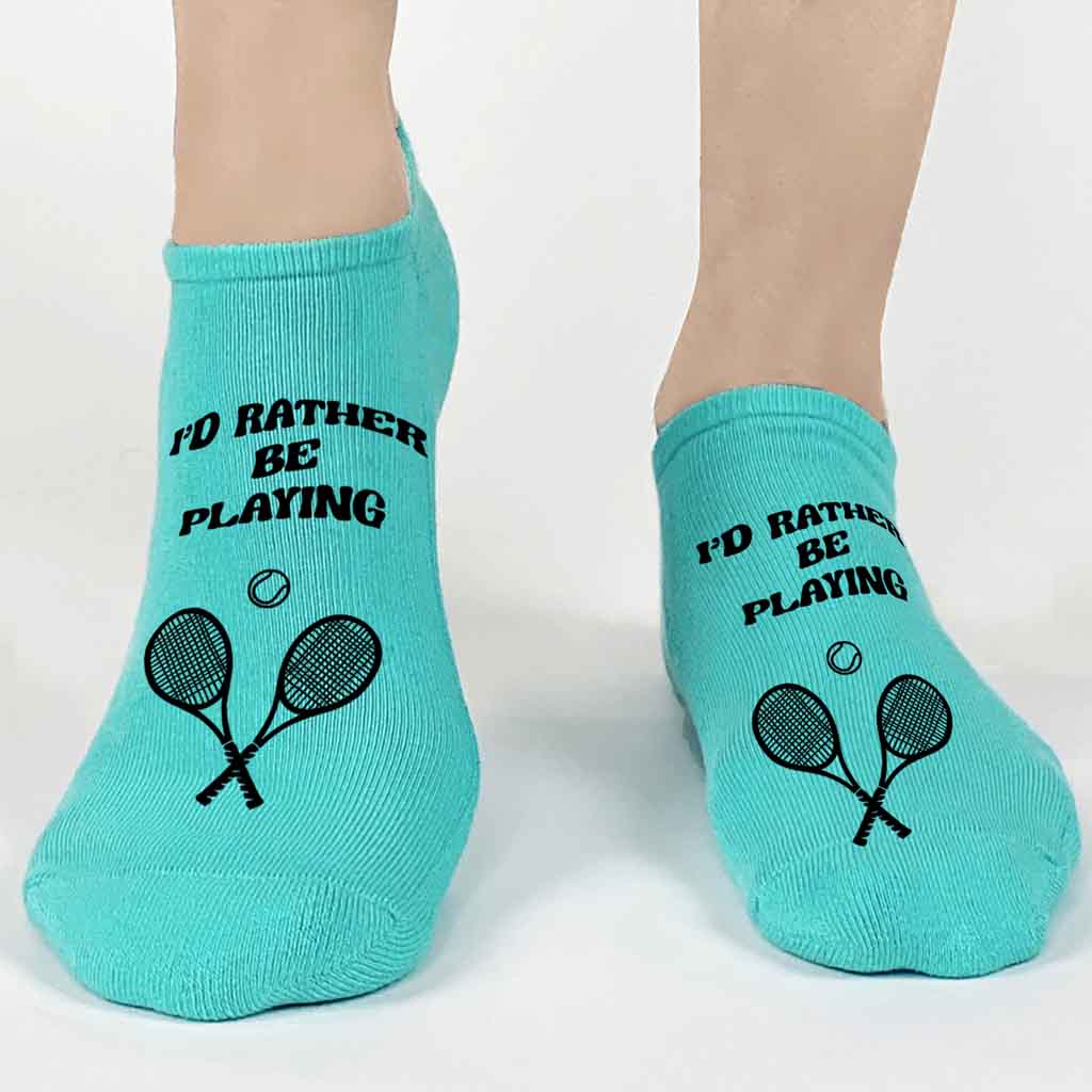 Our teal no show women's footie socks, are 1 of the 3 pairs included in this set for a low price! Printed in black ink with a simple text, "I'd rather be playing" with black tennis racket and ball. 