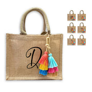 This monogrammed burlap tote bag is available to print with several different ink colors and styles and a cute boho tassel (also available without!).