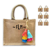 This monogrammed burlap tote bag is available to print with several different ink colors and styles and a cute boho tassel (also available without!).