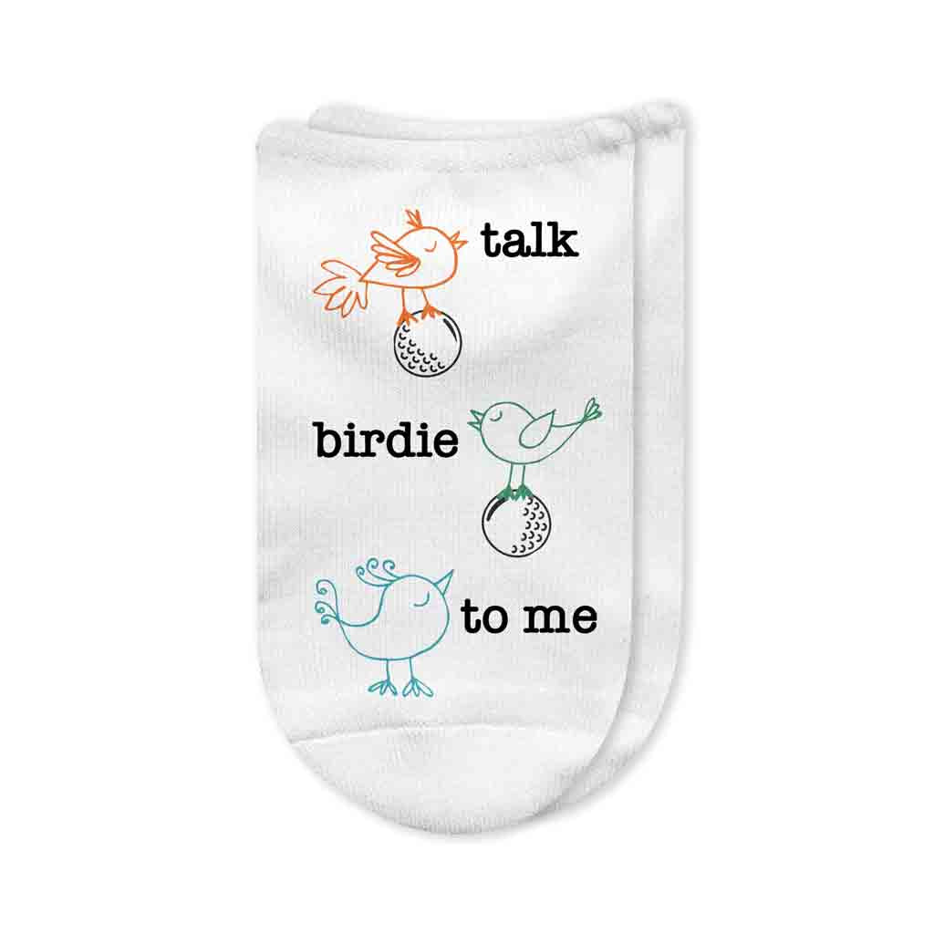 A pair of white no-show golf socks with the phrase "Talk Birdie to Me" printed on top, featuring a fun and playful design. A perfect gift for golfers who love humor on the course.